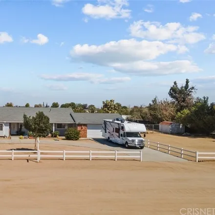 Buy this 4 bed house on 2099 R. Lee Ermey Avenue (West Avenue N) in Lancaster, CA 93551