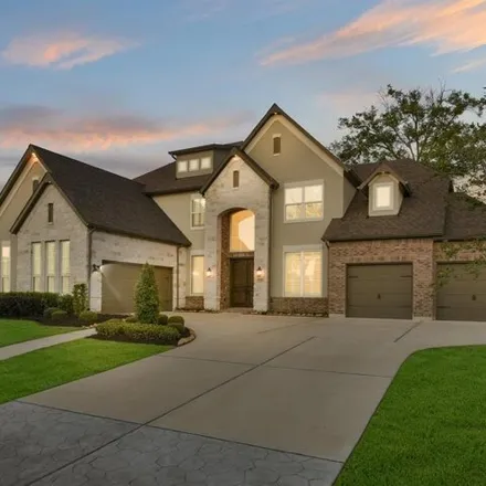 Buy this 5 bed house on 11256 Oakcrest Manor Lane in Towne Lake, TX 77433