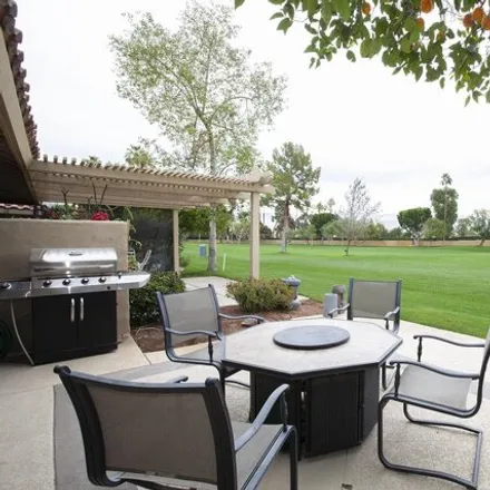 Rent this 3 bed condo on Woodhaven Golf Course in Woodhaven Drive East, Palm Desert