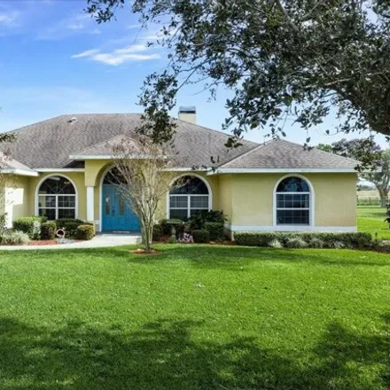 Buy this 4 bed house on 603 Sunset Pointe Dr in Lake Placid, Florida