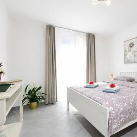 Rent this 2 bed condo on Bioggio in Distretto di Lugano, Switzerland