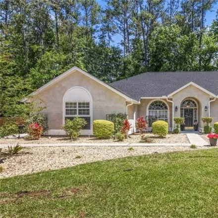 Buy this 4 bed house on 9900 Northwest 24th Place in Alachua County, FL 32606