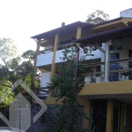 Buy this 4 bed house on Acesso Hélio Alves da Rocha in Vila Nova, Porto Alegre - RS