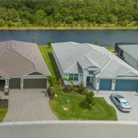 Buy this 4 bed house on Mistiflower Circle in Venice, FL 34292