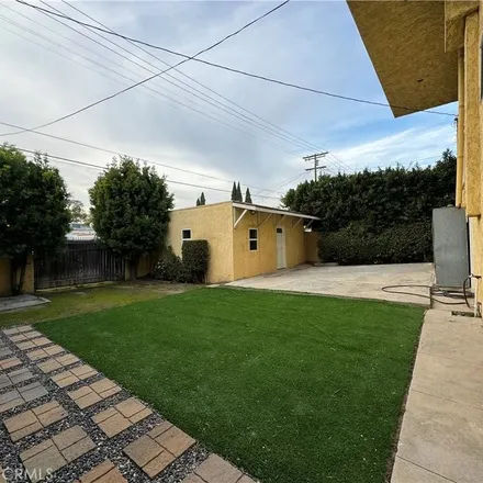 Rent this 4 bed apartment on 1339 South Longwood Avenue in Los Angeles, CA 90019