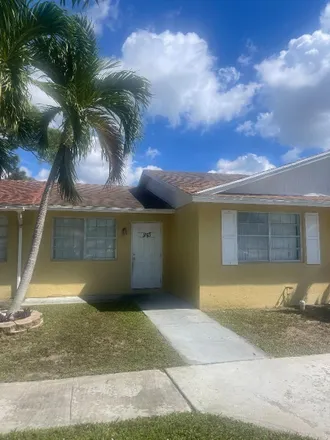 Buy this 2 bed townhouse on 976 Sumter Road East in Palm Beach County, FL 33415