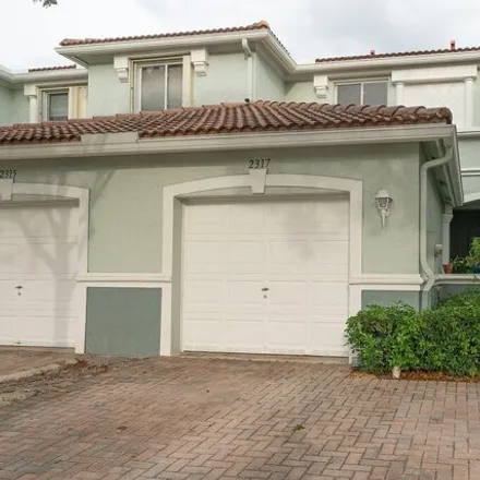 Buy this 3 bed townhouse on 2317 Center Stone Lane in Riviera Beach, FL 33404