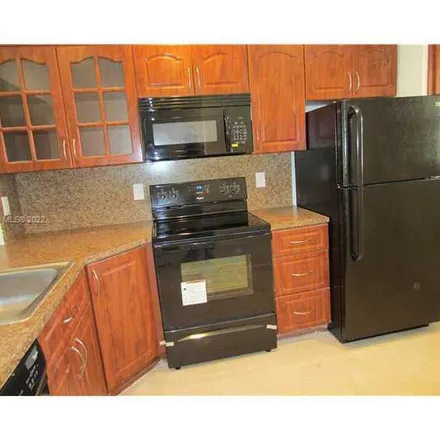 Rent this 3 bed apartment on 862 Northeast 209th Street in Miami-Dade County, FL 33179
