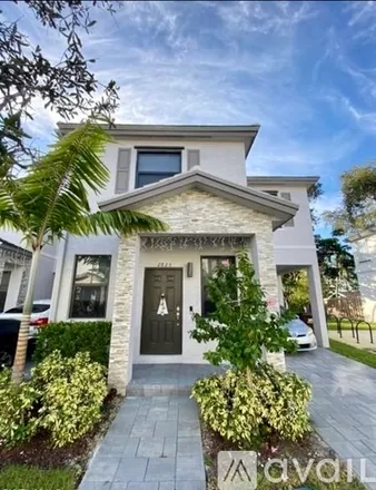 Rent this 4 bed townhouse on 2825 SW 17th Ave