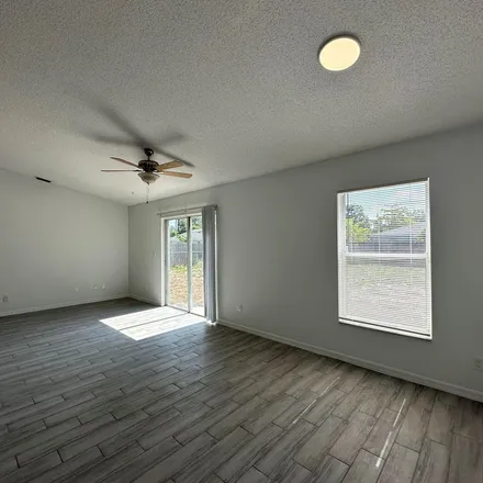Rent this 3 bed apartment on 1023 Hanson Avenue Southwest in Palm Bay, FL 32908