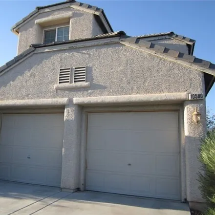 Rent this 4 bed house on 10576 Calico Pines Drive in Summerlin South, NV 89135