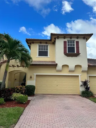 Rent this 3 bed townhouse on 5737 Northwest 119th Drive in Heron Bay South, Coral Springs