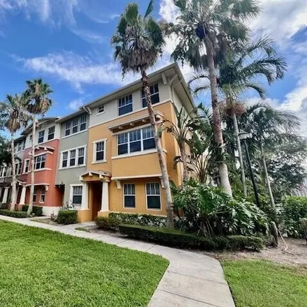 Rent this 4 bed house on 1727 San Benito Way Unit 8 in West Palm Beach, Florida