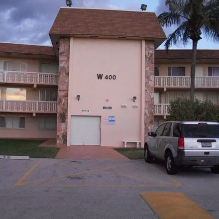 Rent this 1 bed condo on 400 Village Green Circle West in Palm Springs, FL 33461