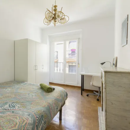 Rent this 6 bed room on Calle de Santa Isabel in 17, 28012 Madrid