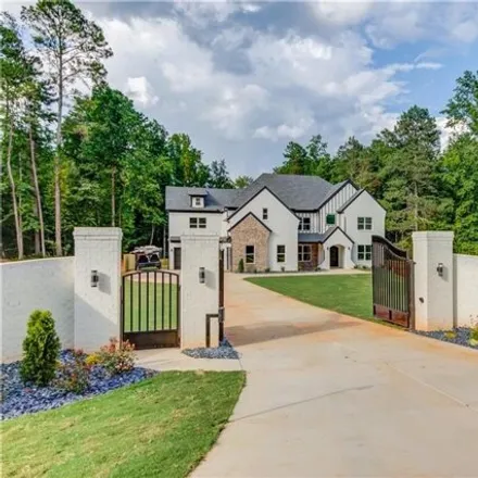 Buy this 5 bed house on 4145 Thompson Mill Rd in Buford, Georgia