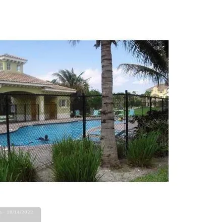 Rent this 4 bed townhouse on 3901 Monarch Lane in Coconut Creek, FL 33073