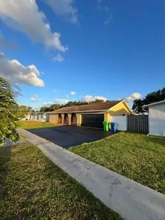 Rent this 4 bed house on 11562 Northwest 34th Place in Sunrise, FL 33323