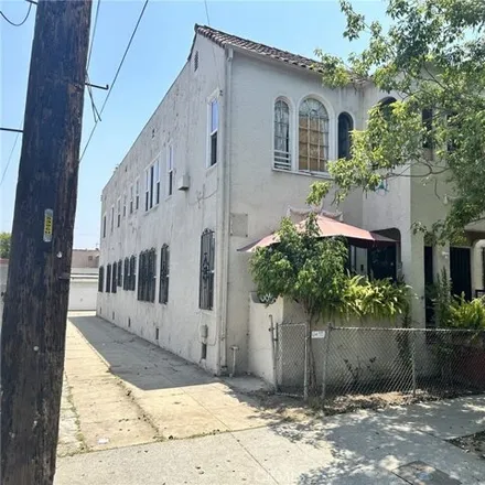 Buy this 8 bed house on 574 N St Louis St in Los Angeles, California