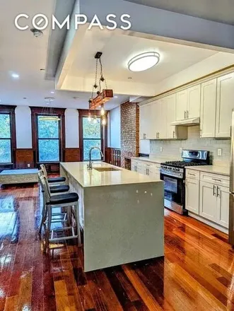 Rent this 4 bed house on 952A Greene Avenue in New York, NY 11221