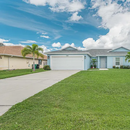 Buy this 4 bed house on 1049 Southwest Spataro Avenue in Port Saint Lucie, FL 34953