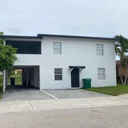 Buy this 4 bed house on 1226 West 35th Street in Riviera Beach, FL 33404