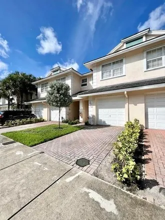 Rent this 2 bed townhouse on 3026 Northwest 30th Terrace in Flamingo Village, Broward County