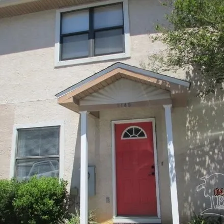 Rent this 2 bed townhouse on 1105 Bloodworth Lane in Ferry Pass, FL 32504