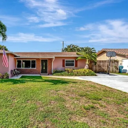 Buy this 3 bed house on 1240 SW 27th Pl in Boynton Beach, Florida