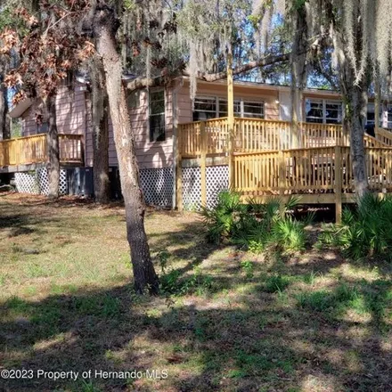 Rent this 3 bed house on 10298 Tooke Lake Boulevard in Hernando County, FL 34613