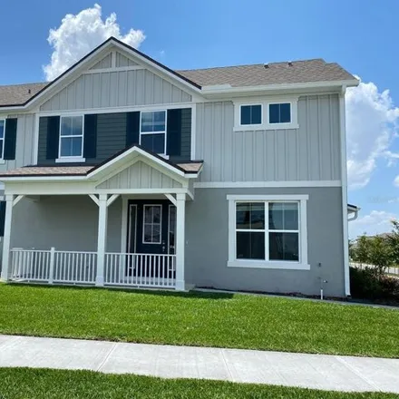 Rent this 3 bed townhouse on Blowing Breeze Avenue in Osceola County, FL 34770