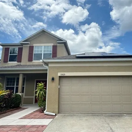 Buy this 5 bed house on 5365 Shasta Daisy Pl in Land O Lakes, Florida