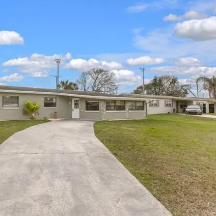Buy this 4 bed house on 1479 Palmwood Drive in Melbourne, FL 32935