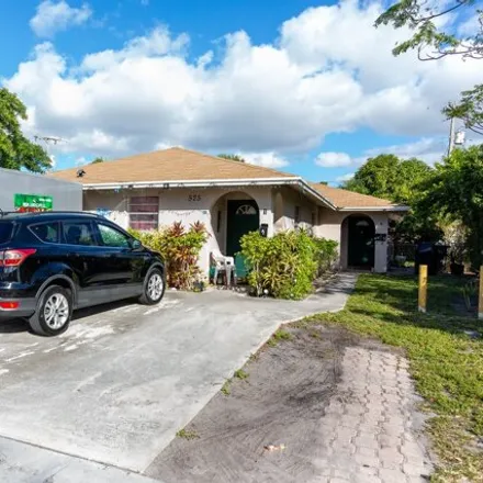 Buy this 4 bed house on 573 Pilgrim Road in West Palm Beach, FL 33405