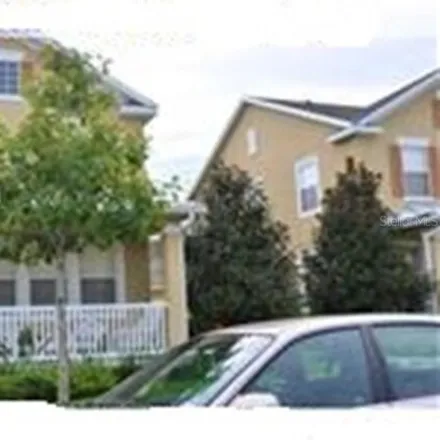 Rent this 4 bed townhouse on Silverback Lane in Orlando, FL 32827