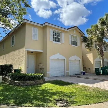 Rent this 3 bed townhouse on 6300 Landings Street in Tamarac, FL 33321