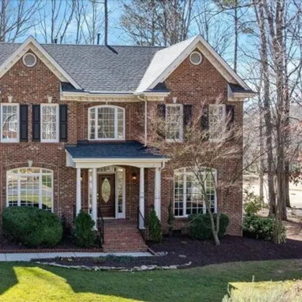 Buy this 4 bed house on 5068 Sunset Fairways Drive in Holly Springs, NC 27540