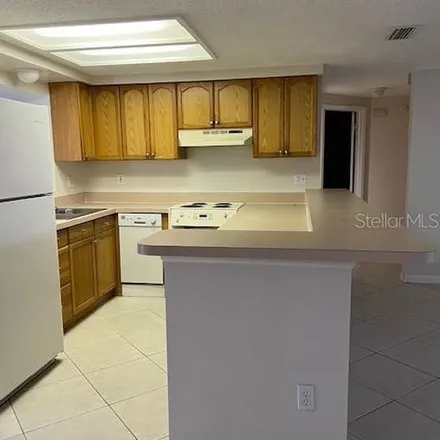 Rent this 4 bed apartment on 6948 Sandalwood Drive in Jasmine Estates, FL 34668