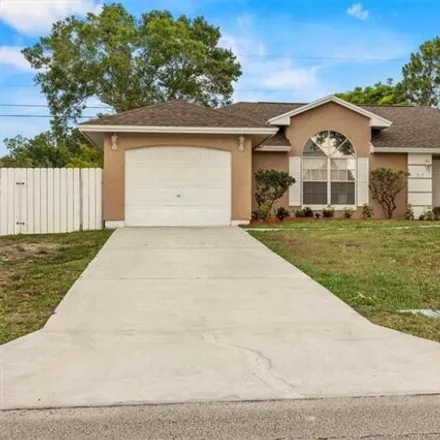 Rent this 3 bed house on 519 Southwest College Park Road in Port Saint Lucie, FL 34953