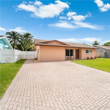 Buy this 4 bed house on 6904 Northwest 33rd Terrace in Palm Aire, Fort Lauderdale
