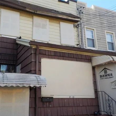 Buy this 4 bed house on 95-22 75th Street in New York, NY 11416