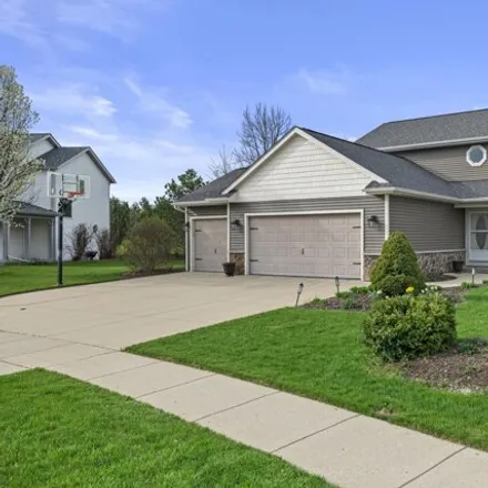 Buy this 4 bed house on 219 Shore Circle in Oconomowoc, WI 53066