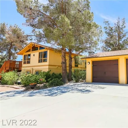 Buy this 4 bed house on 5680 North Dapple Gray Road in Las Vegas, NV 89149