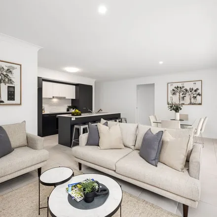 Rent this 4 bed apartment on Tristania Street in Cornubia QLD 4130, Australia