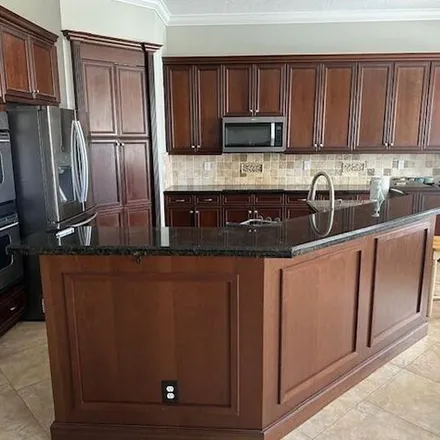 Rent this 5 bed apartment on 10082 Cobblestone Creek Drive in Palm Beach County, FL 33472