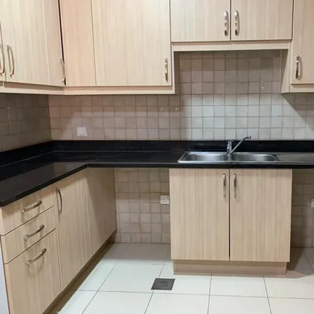 Rent this 2 bed townhouse on Ritaj F-6 in 11 Street, Dubai Investments Park