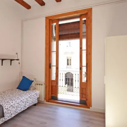 Rent this 6 bed room on Homenatge als castellers in Plaça de Sant Miquel, 08001 Barcelona