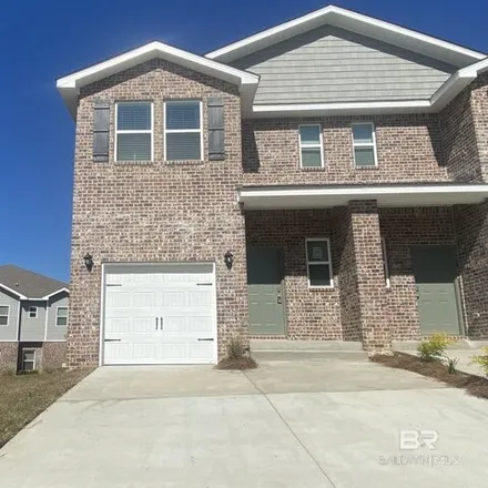 Rent this 3 bed townhouse on 6648 Spaniel Drive in Spanish Fort, AL 36527