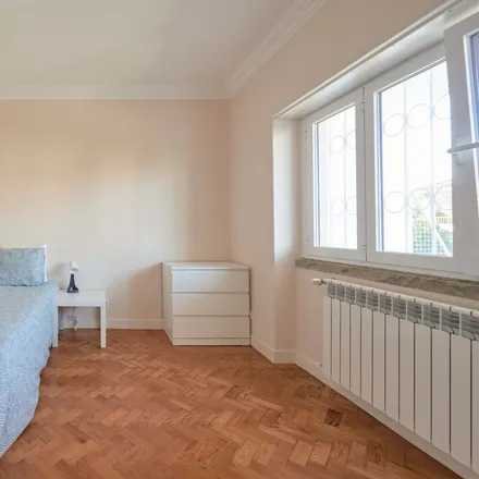 Rent this 14 bed room on Rua Carlos Malheiro Dias 11 in 1700-108 Lisbon, Portugal