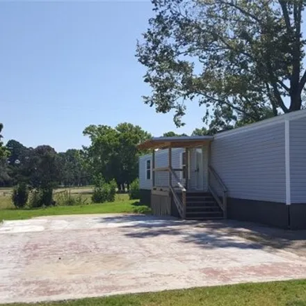 Rent this 3 bed house on 144 Kennedy Street in Willis, TX 77378